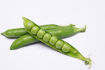 green peas on a white