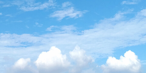 Cloudy blue sky abstract background, blue sky background with tiny clouds. Picturesque view of blue sky with fluffy clouds