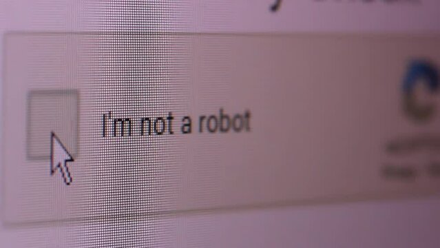 Mouse Cursor And "I'm Not a Robot" Button on Computer Screen. Close Up. 4K Resolution.