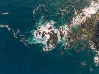 Aerial photos of Farol da Praia in Santiago, Cape Verde showcase a stunning lighthouse on a rugged coastline with breathtaking views of the Atlantic Ocean, surrounded by dramatic cliffs, sandy beaches
