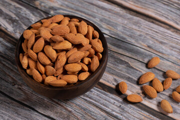 almonds in wooden bowl
