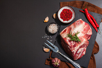 Raw pork loin with spices and herbs. Fresh meat cut, ingredient for cooking protein food