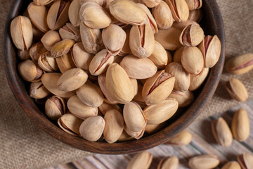 pistachio nuts on wooden background