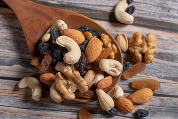 nuts on a wooden spoon
