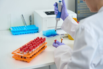Laboratory assistant t in overallswork in the testing unit