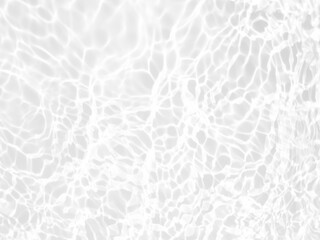 Defocus blurred transparent blue colored clear calm water surface texture with splashes and bubbles. Trendy abstract nature background. Water waves in sunlight with copy space. Blue water shine