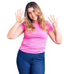 Young caucasian woman wearing sportswear showing and pointing up with fingers number nine while smiling confident and happy.