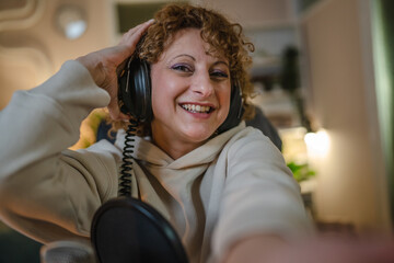 woman shooting or streaming video podcast or vlogg blogger at studio