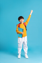Portrait of Asian school boy born on a blue background