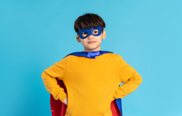 The image of a boy wearing a cape transforms into a hero