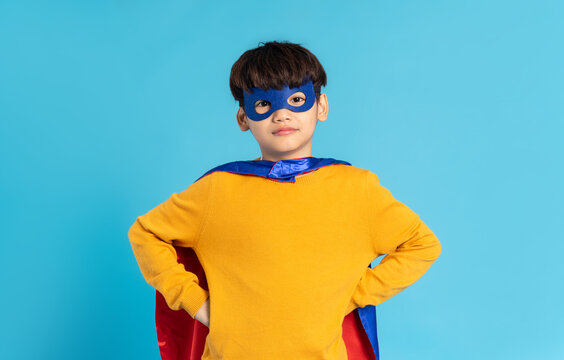 The image of a boy wearing a cape transforms into a hero