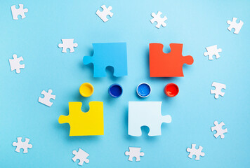 World Autism Awareness Day Card, colorful Puzzles on Blue Background.