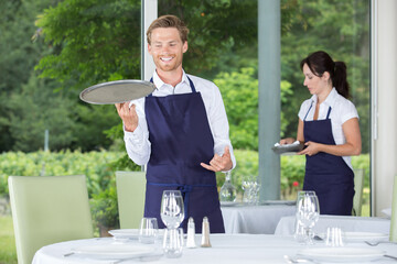 waiter setting up a table