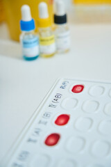 Blood samples on an indicator palette are on laboratory table