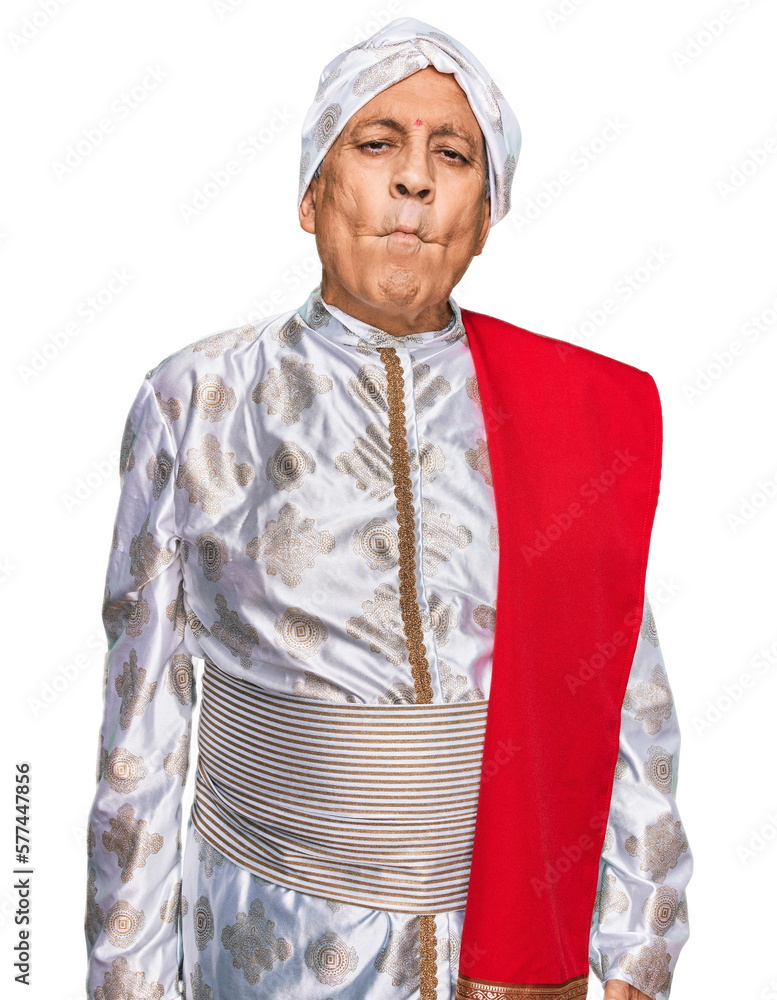 Canvas Prints senior hispanic man wearing tradition sherwani saree clothes making fish face with lips, crazy and c