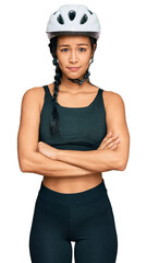 Beautiful hispanic woman wearing bike helmet skeptic and nervous, disapproving expression on face with crossed arms. negative person.