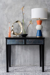Fototapeta na wymiar Eclectic decorations on console table