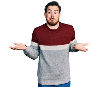 Young hispanic man wearing casual clothes clueless and confused expression with arms and hands raised. doubt concept.