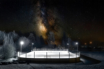 Outdoor hockey rink under the milky way