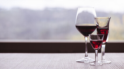 Elegant glasses of wine on a kitchen table