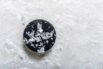 Puck on ice hockey rink surface, sport background. Horizontal sport poster, greeting cards, headers, website and app