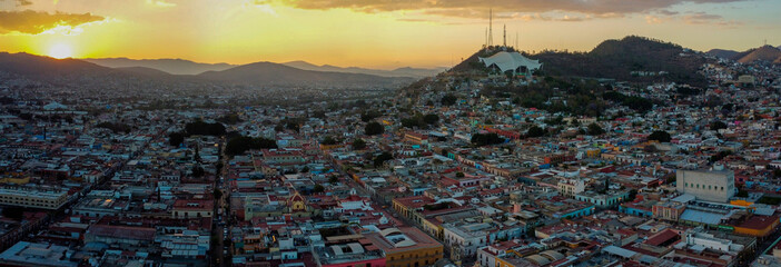 drone shot panoramic view of a sunset over oaxaca city mexico