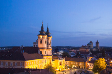 Naklejka premium Beautiful view of the Minorit church and the panorama of the city of Eger, Hungary, at sunset