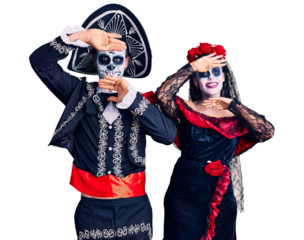 Young couple wearing mexican day of the dead costume over background smiling cheerful playing peek a boo with hands showing face. surprised and exited
