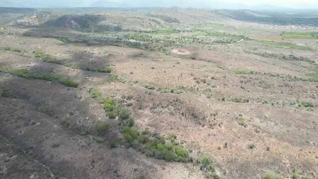 Riding a drone trough a very arid place,