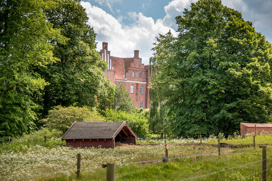 Auning, denmark - 19 June 2021: Pig house is seen behind the buildings at Gammel Estrup Castle