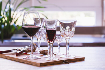 Elegant glasses of wine on a kitchen table