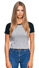 Obraz premium Young blonde woman wearing casual clothes skeptic and nervous, frowning upset because of problem. negative person.