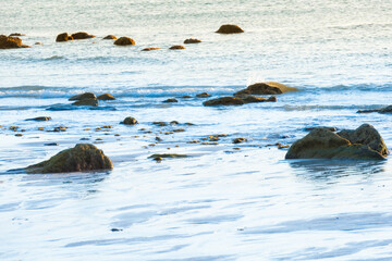 Sunset sea and beach with rocks and sunset