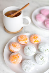 Mango Mochi ice cream, Matcha Mochi ice cream and Strawberry Mochi ice cream with green tea on the table