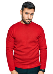 Obraz premium Young hispanic man wearing casual clothes skeptic and nervous, frowning upset because of problem. negative person.