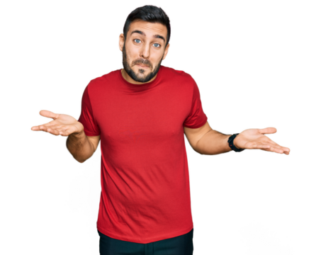 Young hispanic man wearing casual clothes clueless and confused expression with arms and hands raised. doubt concept.