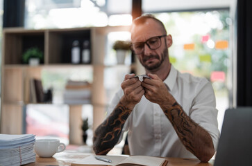 Stressed caucasian man breaking his credit, card bankruptcy, financial problems concept