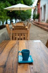 Tables of a restaurant in an exterior corridor on the banks of the Magdalena river in the town of Mompox. Colombia.
