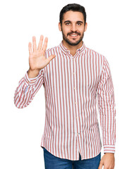 Young hispanic man wearing business shirt showing and pointing up with fingers number five while smiling confident and happy.