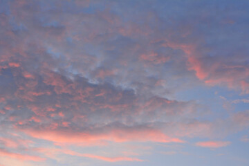 dramatic cloudscape with pink clouds in the sky isolated on evening sky 