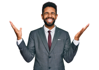 Young african american man wearing business clothes celebrating mad and crazy for success with arms raised and closed eyes screaming excited. winner concept