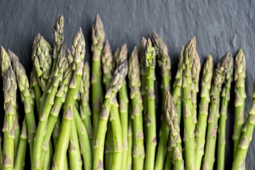 Asparagus green on a dark table