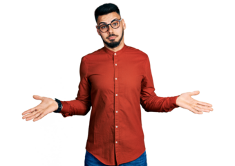 Young hispanic man with beard wearing business shirt and glasses clueless and confused expression with arms and hands raised. doubt concept.