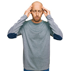 Naklejka premium Bald man with beard wearing casual clothes with hand on head for pain in head because stress. suffering migraine.