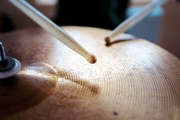 Closeup of drumsticks and the drum set. Drummer equipment. Drum and cymbal. Music background. Drums...
