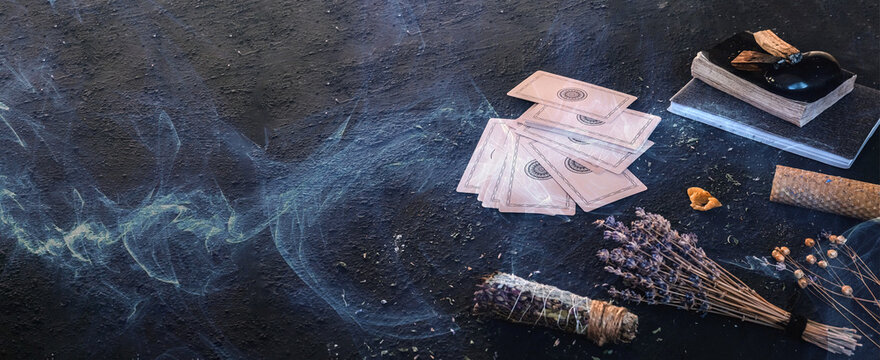 Tarot, astrology,Esoteric, Occult mystical ritual scene of sorcery tarot candles,dried flowers, palo santo tarot cards, ritual book.Witchcraft,mysticism and occultism,esoteric background,tarot banner