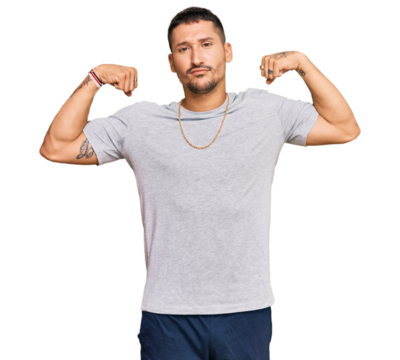 Handsome man with tattoos wearing 90s style showing arms muscles smiling proud. fitness concept. - Powered by Adobe