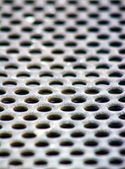Industrial Gray Metal with Circular Holes for a Background, Backdrop or Wallpaper