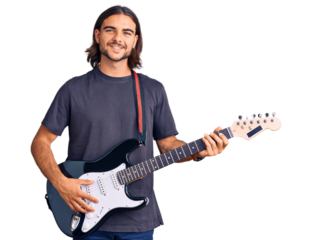 Young handsome man playing electric guitar looking positive and happy standing and smiling with a confident smile showing teeth