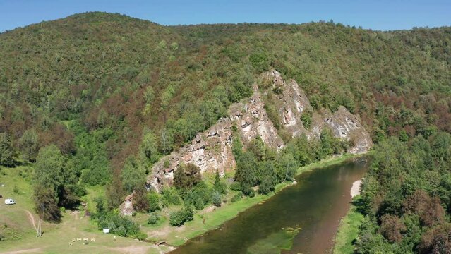 Southern Urals, rocks by the mountain river Zilim near the Kinderlin cave. Aerial view.